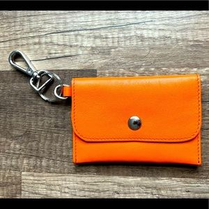 Orange borlino brand card/key holder with clip